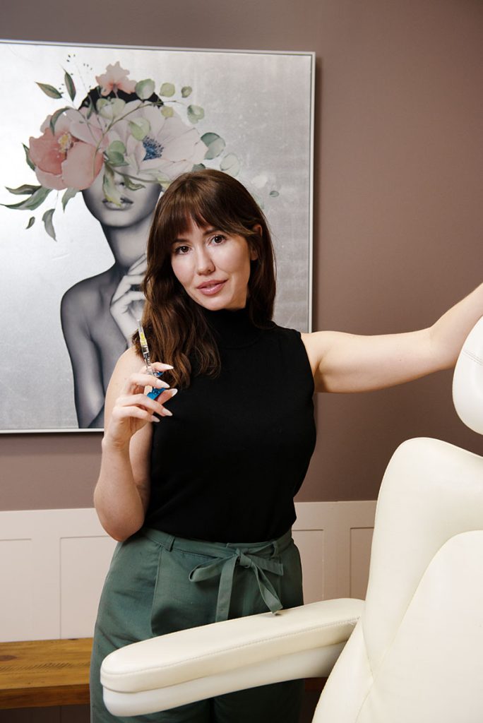 Dr Stephanie holding an injectable in her Gilbert, AZ office.