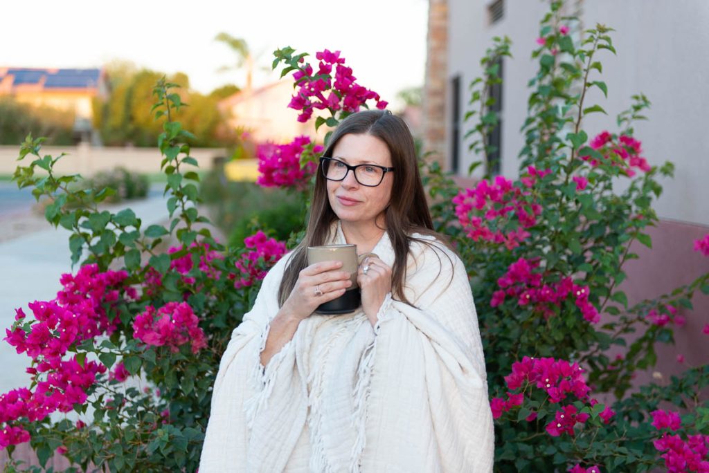 Menopausal Woman holding a mug.